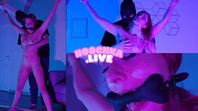 Pink-haired alt girl moans in submission during French bondage session