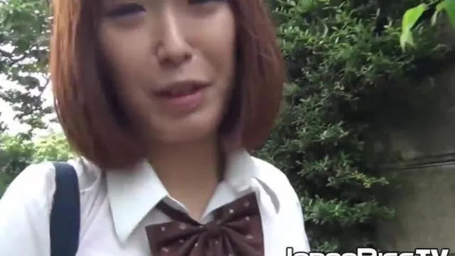 Japanese schoolgirl soaks her panties up at a rainy day