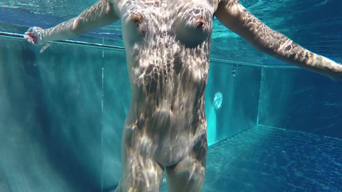 Hot teen with small saggy tits swims nude in a public pool and touches a small dick