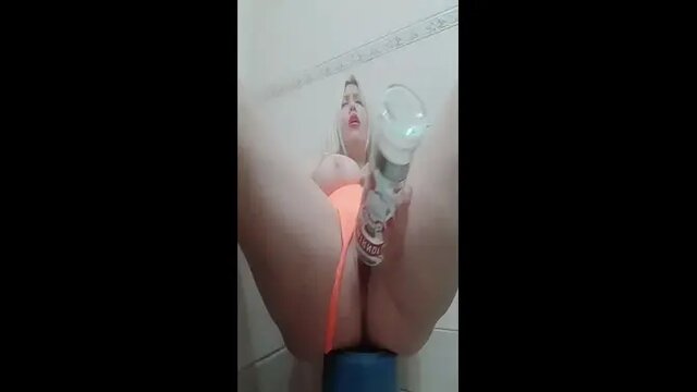 Teen beauty gets bottle of vodka in her pussy