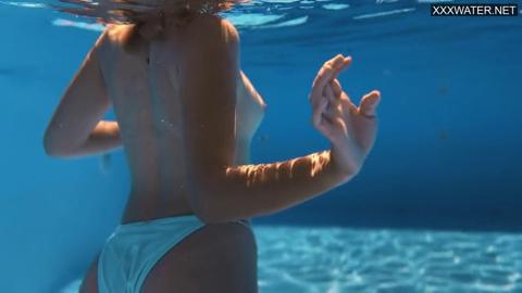 Sofi Otis, poolside paradise: big tits, wet nipples on display