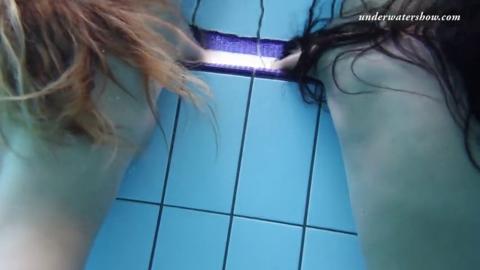 Silvie and Zhanetta splash about topless in the pool