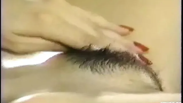 Thai mistress unfurls her bushy pussy✌ for a solo bedroom romp on the sheets′