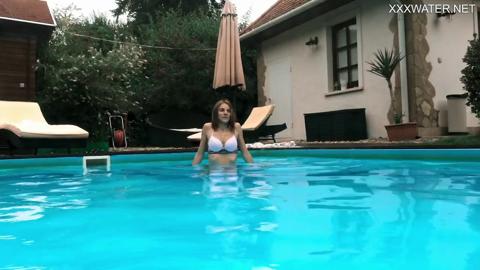Slim European girl Hermione heats up at the pool