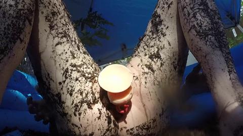 Trans woman explores muddy pleasure